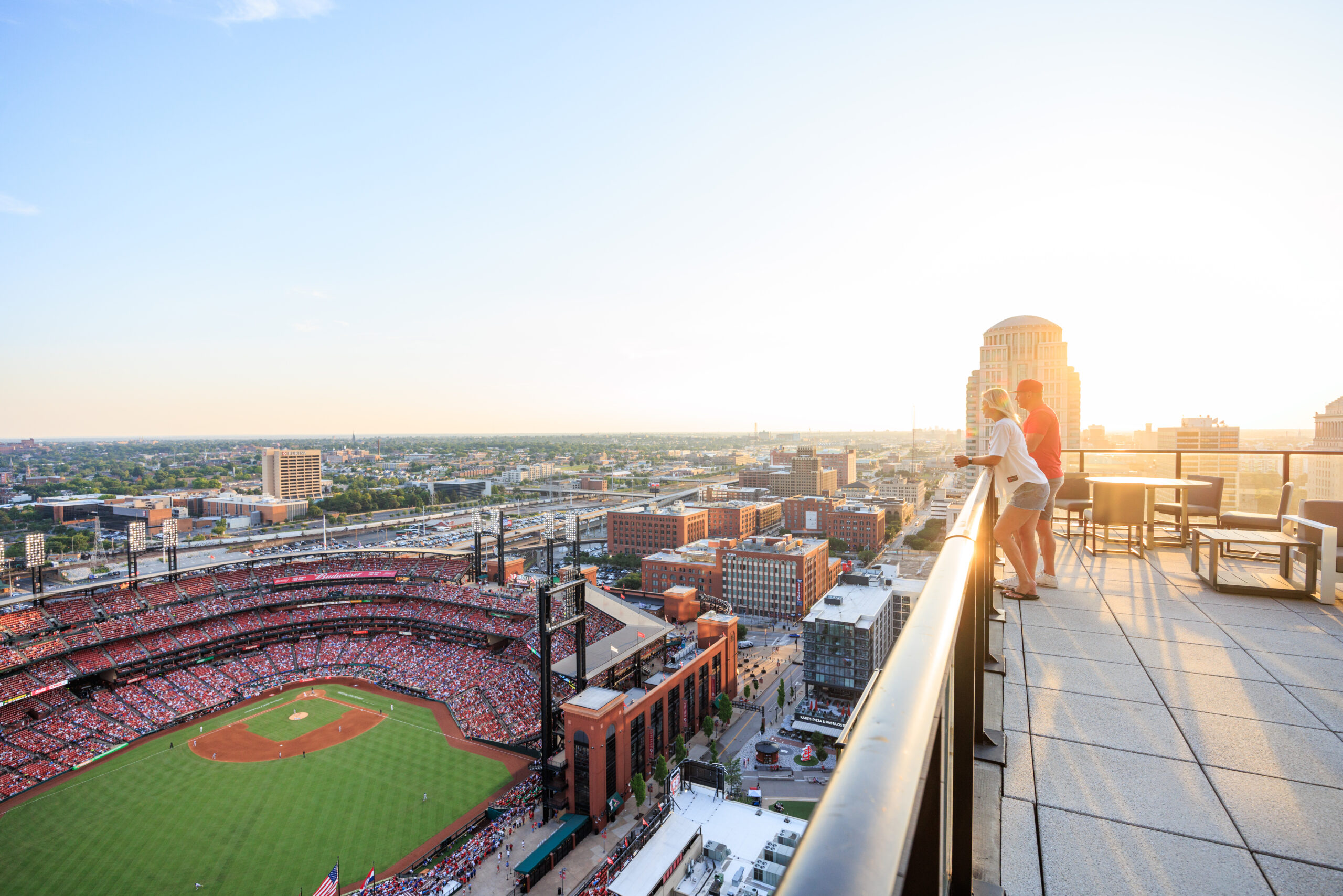 couple on balcony overlooking Busch Stadium